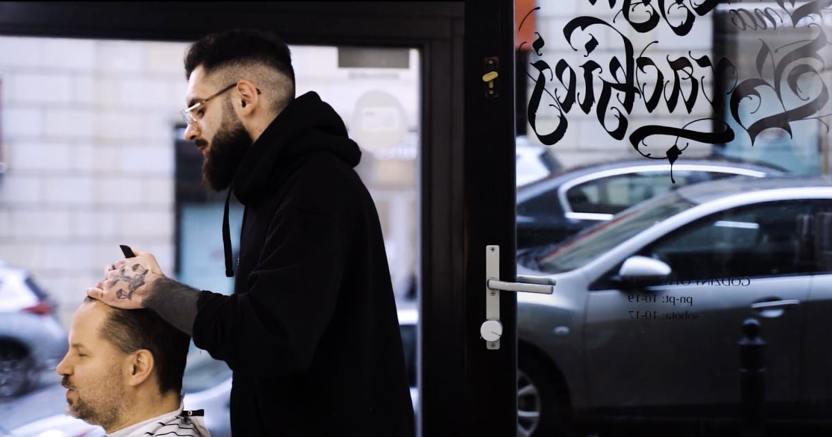 Barber styling customer's hair