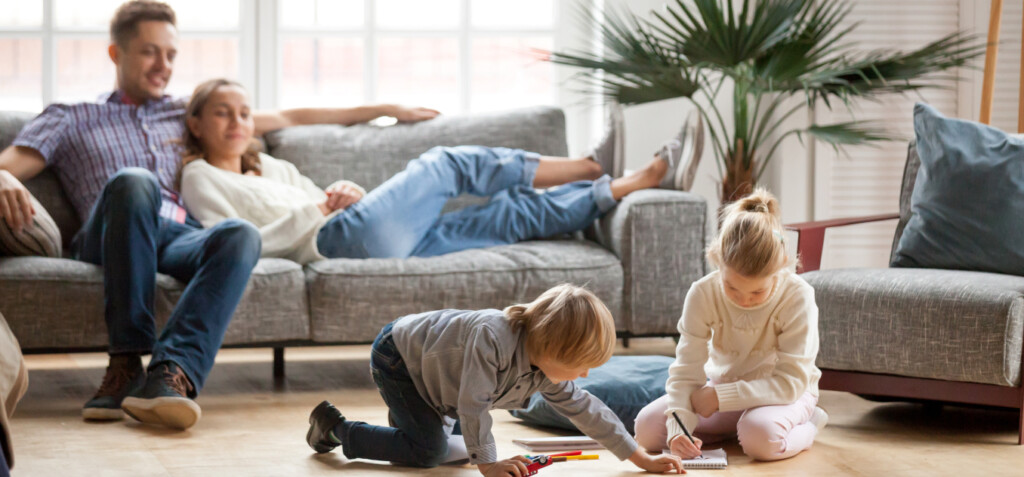 Parents watching over children playing