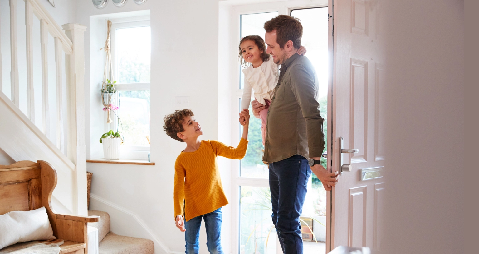 A father and his two children enter the flat