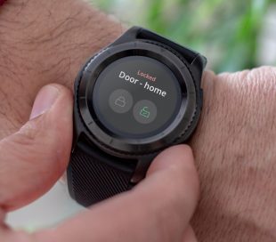 Smartwatch on wrist with tedee app running