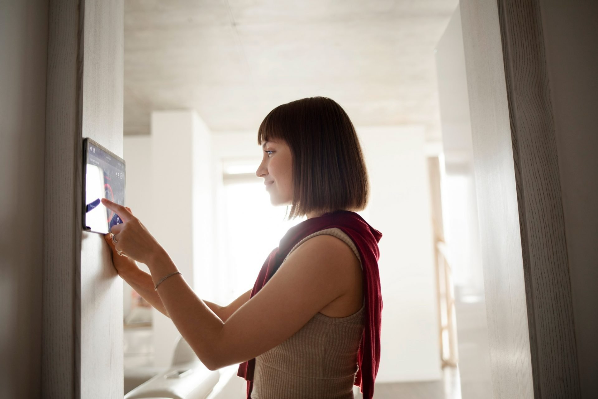 young woman using home technology 2 scaled